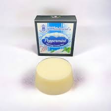 Peppermint shaving soap: a round soap block beside its box